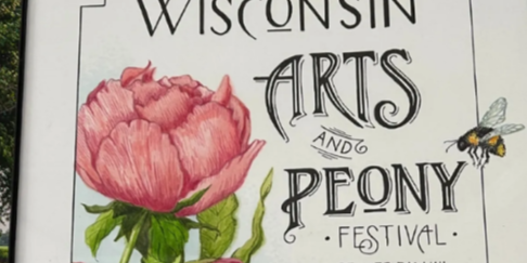 Sign for the Wisconsin Arts and Peony Festival featuring illustrated pink peony flowers and a bee, with text reading “Wisconsin Arts and Peony Festival, Beaver Dam, WI.”